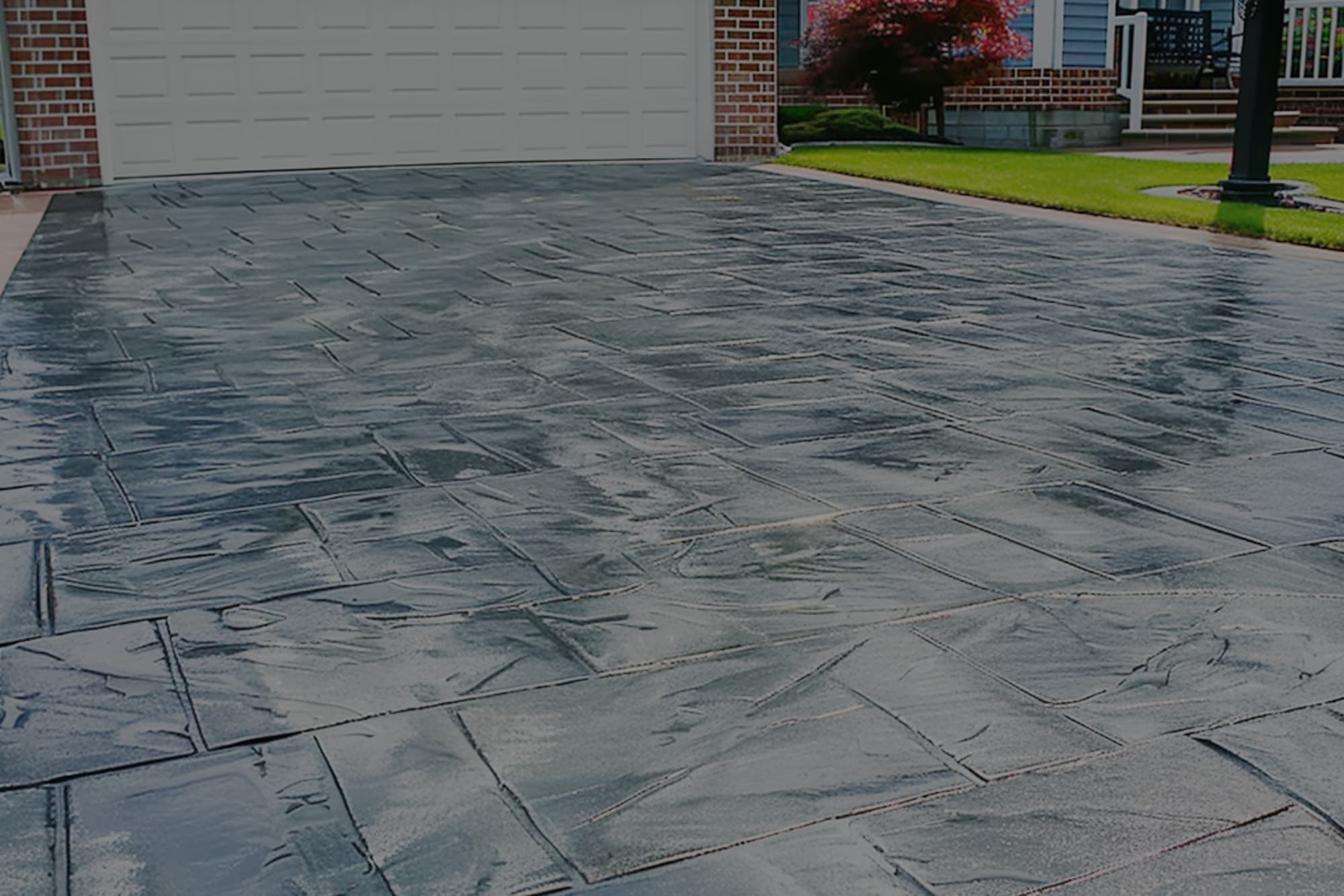 A Grayish-Black Stamped Concrete Driveway